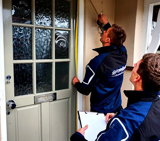 Team working out a security door quote for a client.