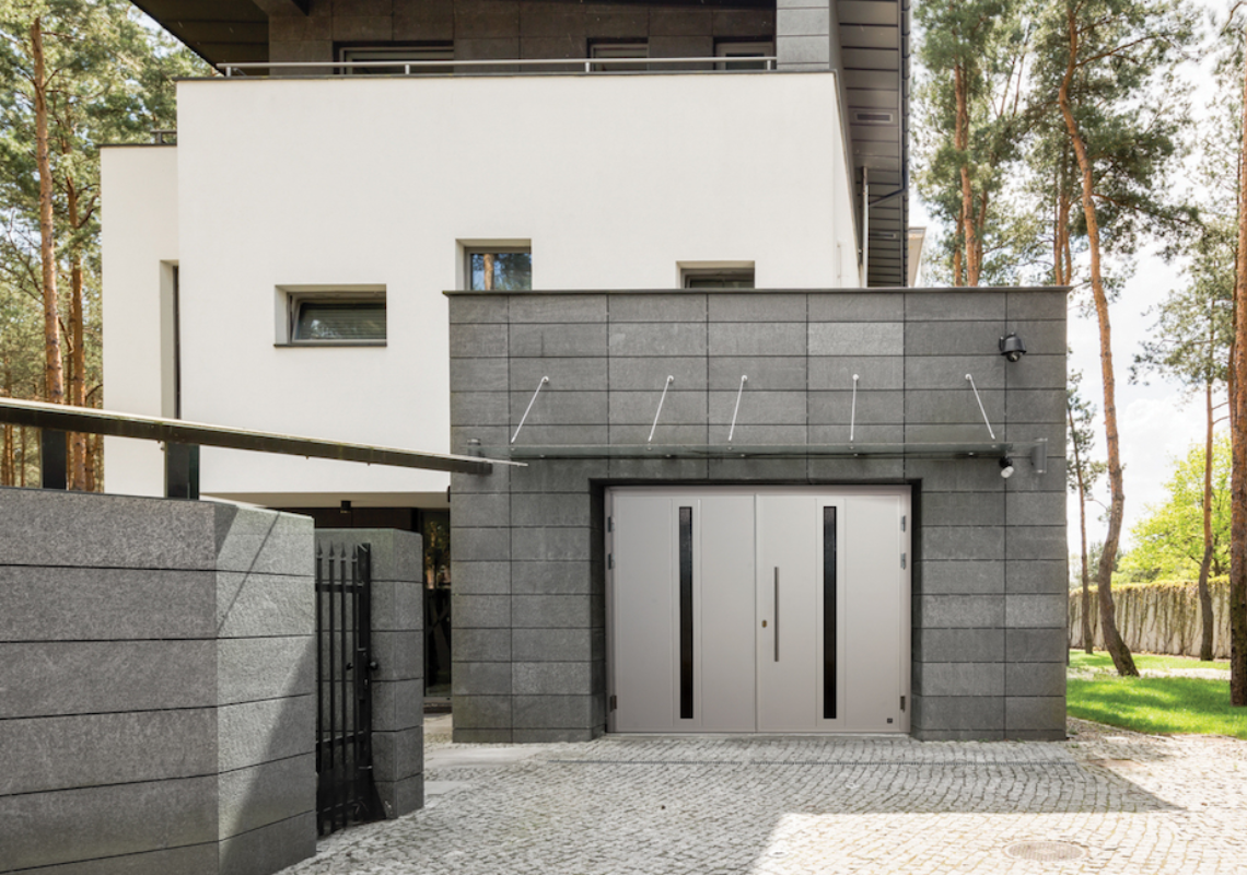 A side hinged security garage door installed by Stronghold Security Doors.